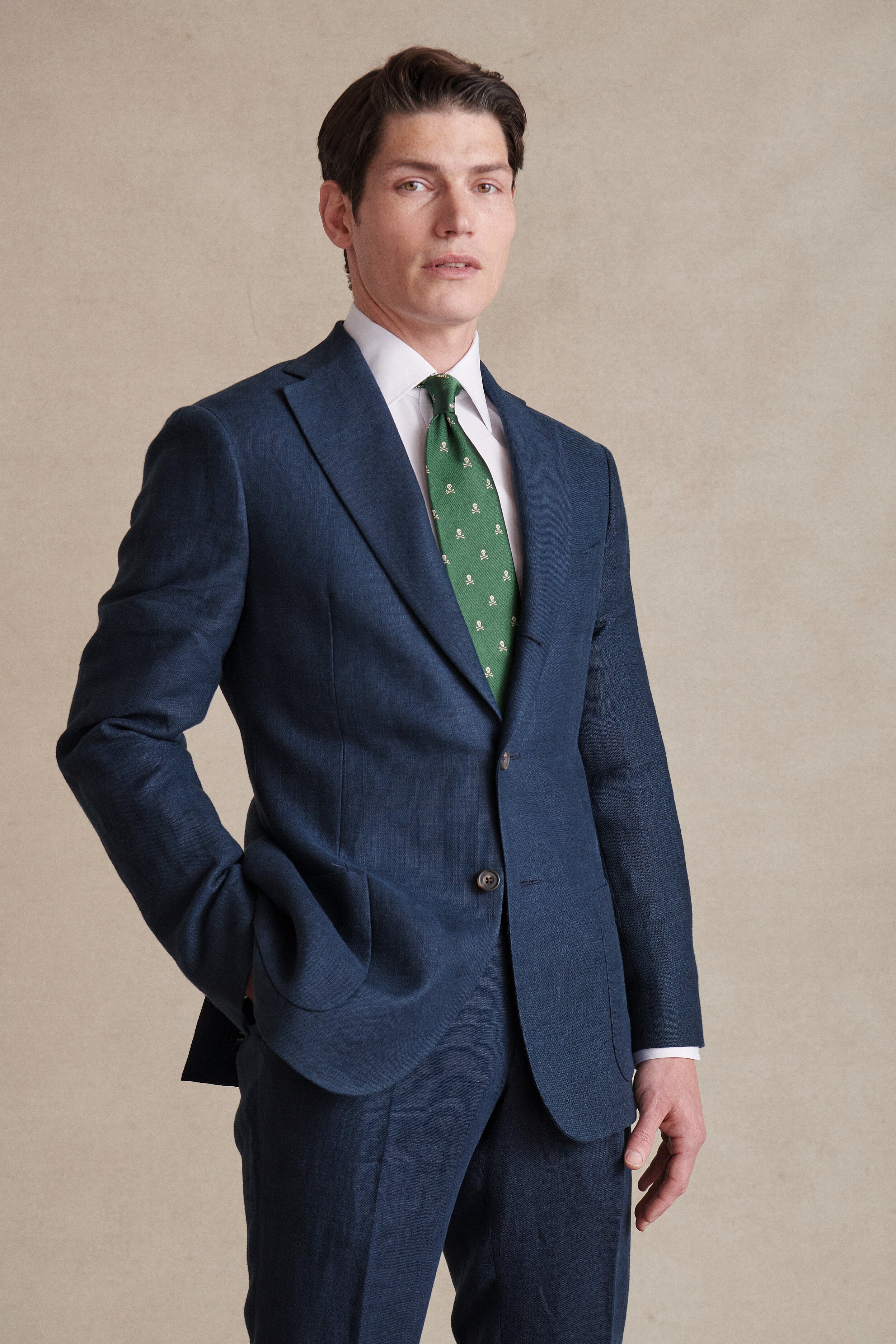 A navy French linen single-breasted jacket, buggy lined.