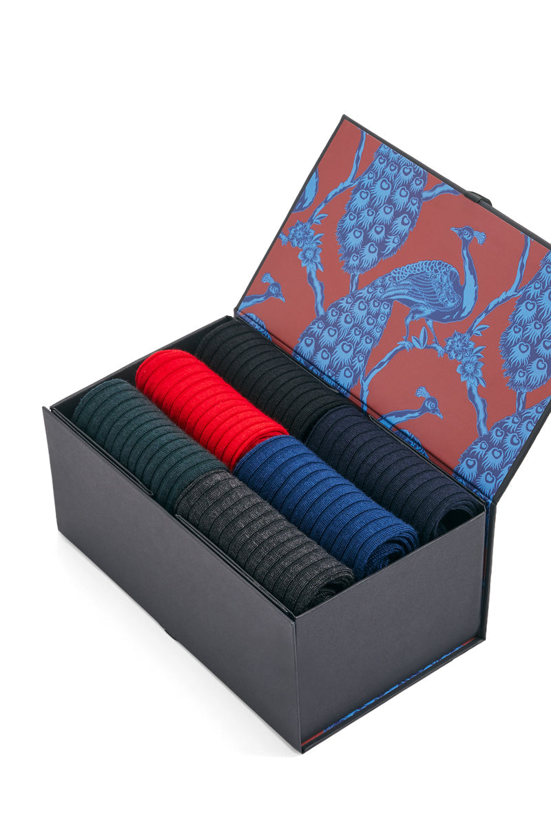Box of colorful socks with a decorative lid on a white background