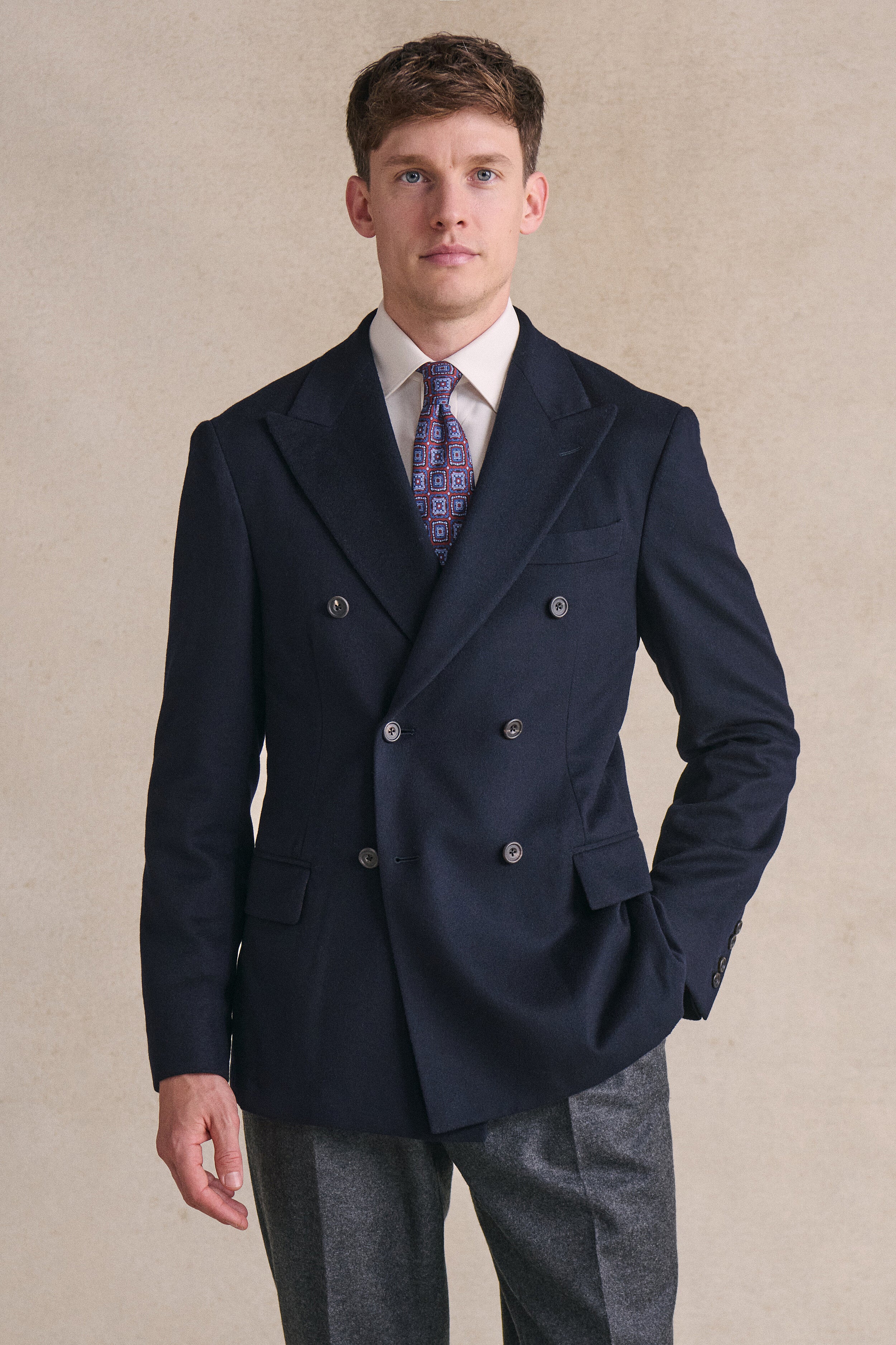 A navy double-breasted blazer in Loro Piana cashmere.